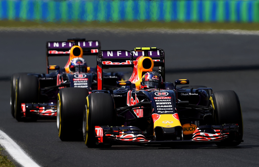 BUDAPEST, HUNGARY - JULY 26:  Daniil Kvyat of Russia and Infiniti Red Bull Racing drives ahead of Daniel Ricciardo of Australia and Infiniti Red Bull Racing during the Formula One Grand Prix of Hungary at Hungaroring on July 26, 2015 in Budapest, Hungary.  (Photo by Lars Baron/Getty Images)